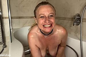 horny milf bathes outdoors spreading big pussy lips with dildo in pool