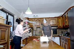 Emmita's huge natural tits bounce wildly during xmas kitchen ride ending in terry's deep anal creampie