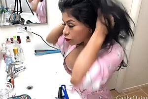 Latina milf Gabby Quinteros seductively poses in front of her bedroom mirror