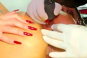 Tattoo guy inks whore's tight asshole while fucking it hard