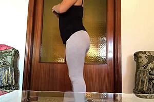 arab muslim woman does sport and yoga at home