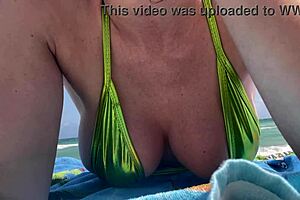 italian milf artemisia flashes huge boobs beach bikini tease?