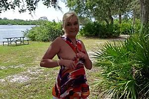 the blonde milf housewife strips teasingly outdoors flashing her shaved assets publicly in high heels pov close up