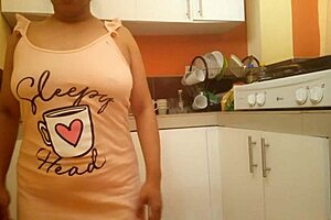 Step mom with big ass and busty tits fingers her wet pussy right in the kitchen now.