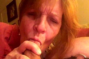 Granny Carmen moans while sucking hard cock