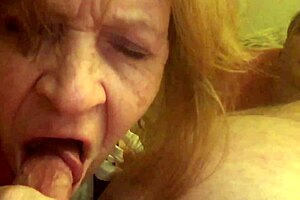 Granny Carmen moans while sucking hard cock