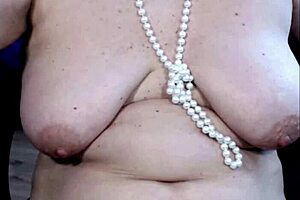 charming mature lady fists her juicy shaved pussy closeup with whore smile?