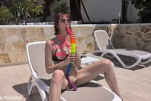 ughh i cant believe this skinny redhead takes that huge anal snake dildo outdoors...