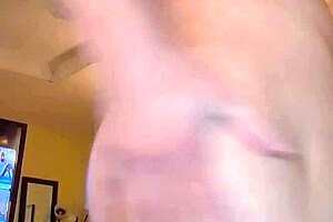 Watch this slutty milf tease and strip her shaved pussy bare.