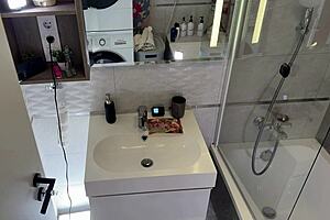 hottest redhead milf wife teases in shortest skirt fishnets in bathroom, wanna see?