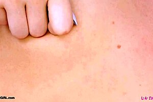 captivating blonde model strips down showing off her sexy petite body on sofa