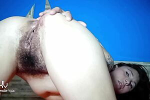 This petite Latina bends over, fingering her huge hairy pussy doggystyle till soaked.