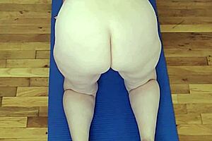 Milf stretches naked in yoga pose