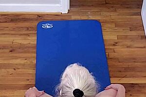 Milf stretches naked in yoga pose