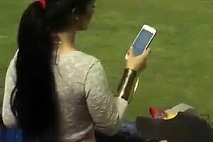 Damn, watching this milf's juicy ass shake in leggings at the stadium has me hooked!