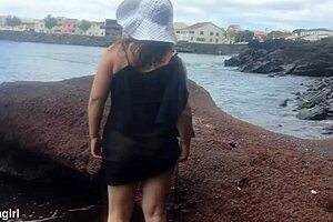 curvy brunette dresses sexy for beach photoshoot then fingers pussy voyeur style