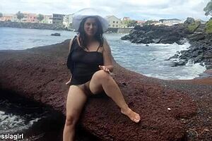 curvy brunette dresses sexy for beach photoshoot then fingers pussy voyeur style