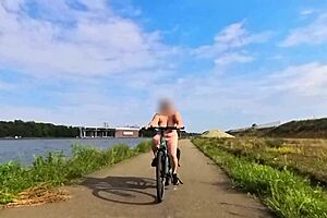 imagine this huge natural titted milf biking nude outdoors, flashing saggy boobs everywhere
