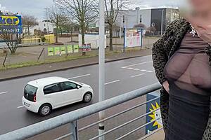 Milf exposes big tits in sheer street top