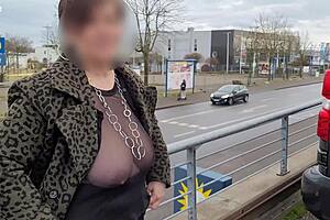 Milf exposes big tits in sheer street top