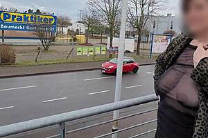 Milf exposes big tits in sheer street top