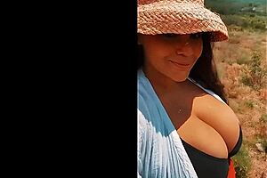 busty italian bimbo bombshell struts her stuff outdoors in spring