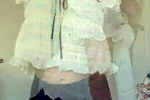 Sexy blonde cougar milf strips lingerie, spreads curvy pussy wide on bed.