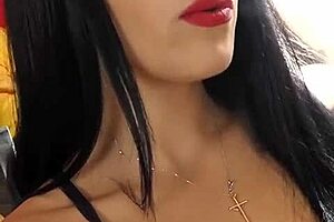 Yasmin smokes while fingering pussy in shiny black leather boots