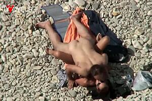 Pretty wife flashes natural tits for beach voyeur on summer vacation