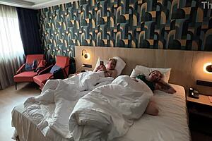 Step mom gasps as stepson unloads huge facial on her shocked face in shared hotel bed