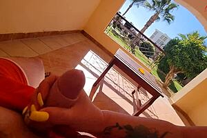 stepmom jerks off stepsons cock right on the terrace balcony