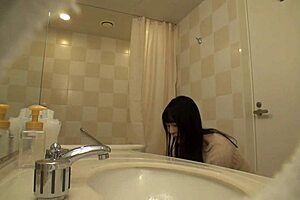 Japanese milf cosplayer bares huge natural tits for hotel shoots