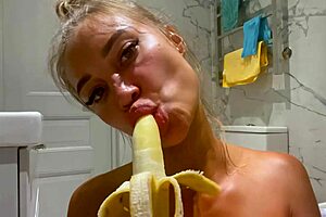 Monika Foxxx fingers shaved pussy then rams banana deep in bathroom solo