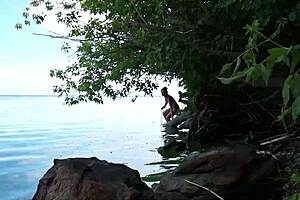 Topless babe spears fish with hidden harpoon thrills