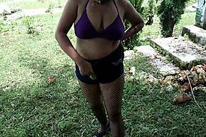 stepmom crams bottle deep in pussy amid jungle heat