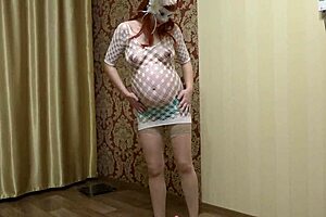 PREGNANT RUSSIAN MILF IN STOCKINGS SHOVES PANTIES ASIDE AND FUCKS HAIRY PUSSY WITH DILDO