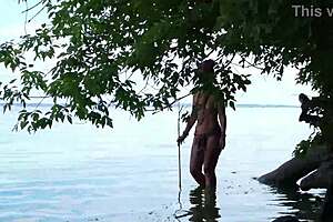 Topless babe spears fish with hidden harpoon thrills