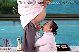 REGINA NOIR SUCKS BOSS COCK BY NUDIST POOL!