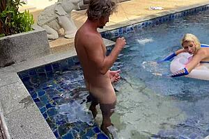 Blonde babe rides big cock cowgirl at outdoor pool!