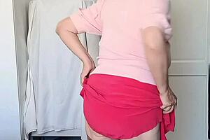 Mature blonde wears red skirt and stockings showing curvy figure in homemade teasing video