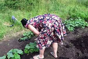 Mature housewife enjoys cucumber play in garden then returns home