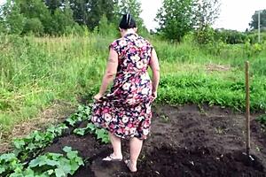 Mature housewife enjoys cucumber play in garden then returns home