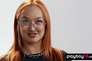 Redhead milf fingers her shaved pussy