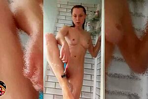 Wet look horny milf shaves smooth in soapy shower scene