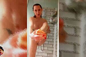 Wet look horny milf shaves smooth in soapy shower scene