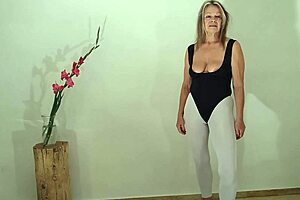 Grandma in white leggings and a sexy swimsuit