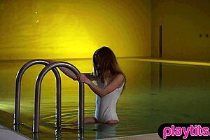 tiny blonde russian milf skinny dips in pool