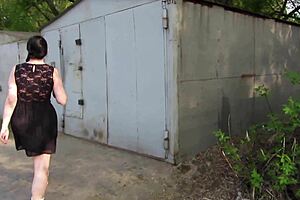 Milf pees outdoors behind public garages